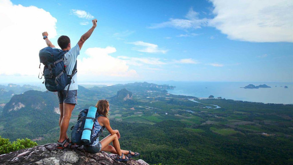 Exhilarated Couple Reaches Scenic Summit in Sri Lanka