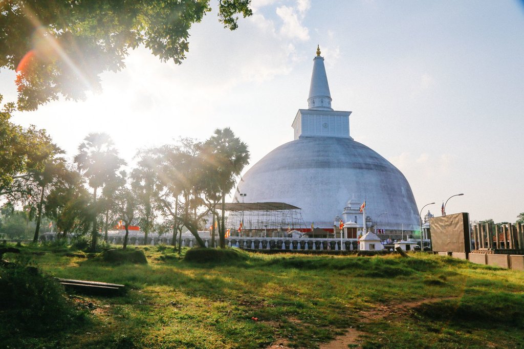 Ruwanwelisaya Stupa, a sacred Buddhist site in Sri Lanka, bathed in golden sunlight.