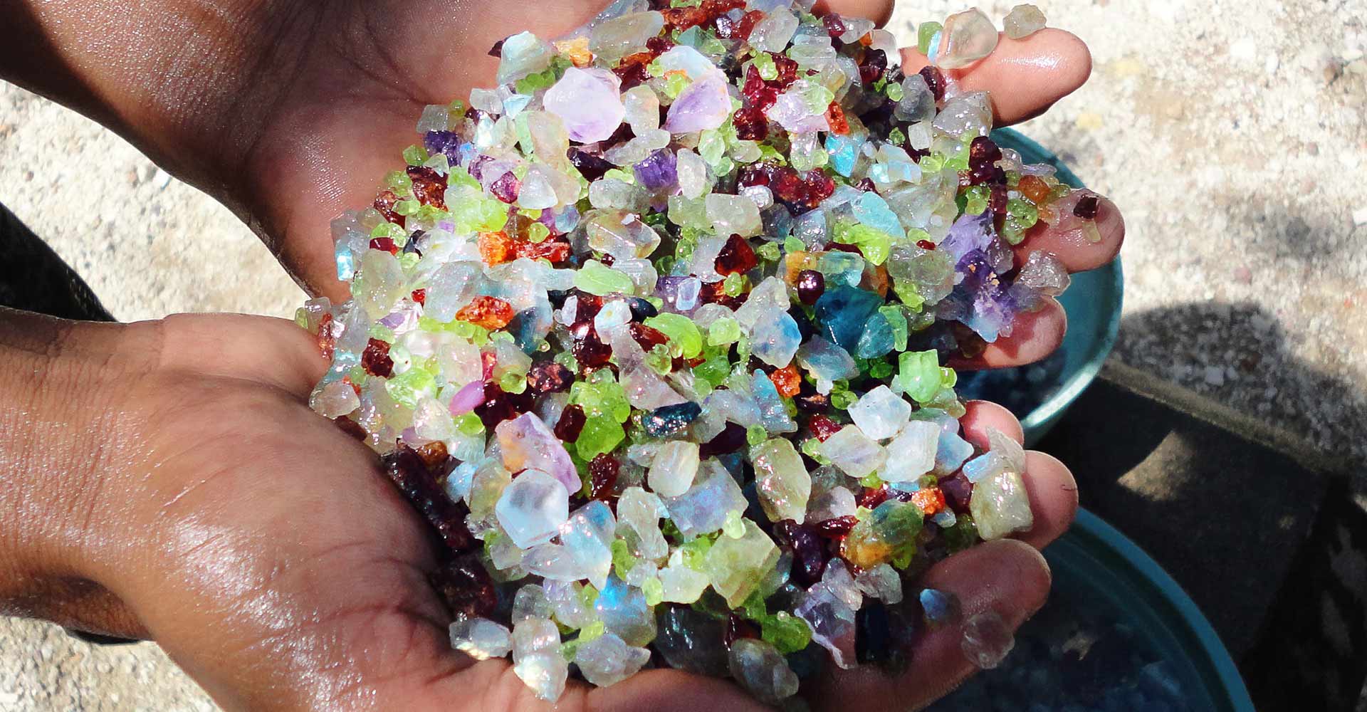 Thrills of Paradise 24 Gleam Pearl Tours Sri Lanka: Moonstone Mining. Close-up of raw moonstone mined in Sri Lanka, held in the hand of a local miner. Explore Sri Lanka's gem treasures with GPTours.lk.