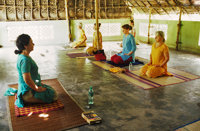 Thrills of Paradise 20 A group of women practicing yoga at the International Center for Yoga Education and Research in India.